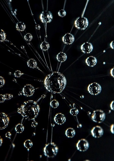 cossolou_regular_pattern_of_bright_water_drops_on_black_table_c8f50323-b5de-434a-8dba-49833bd48f5a_3